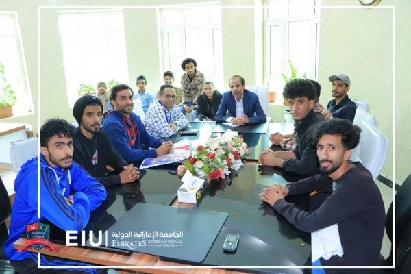 The university president meets the university's first football team and congratulates the university's leadership