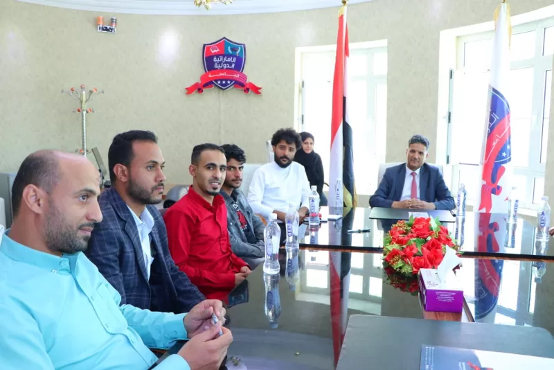 The president of the university meets the first university football team and blesses the university's lead to the finals of the university league championship