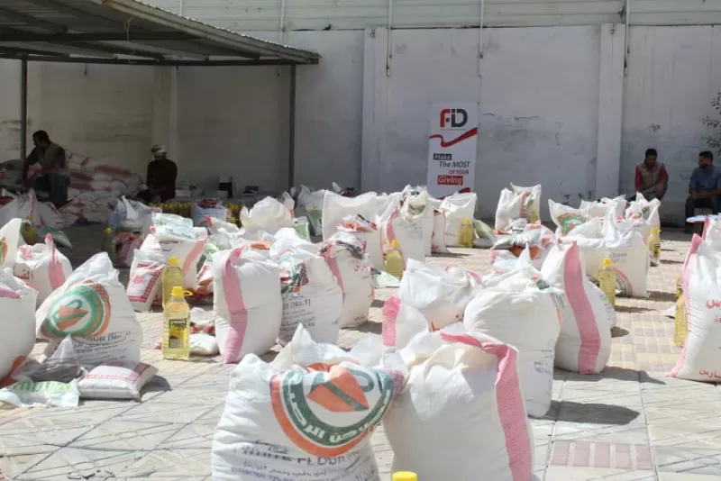 FID, in cooperation with the Emirates International University in Sana'a, distributes more than 700 food baskets to needy families