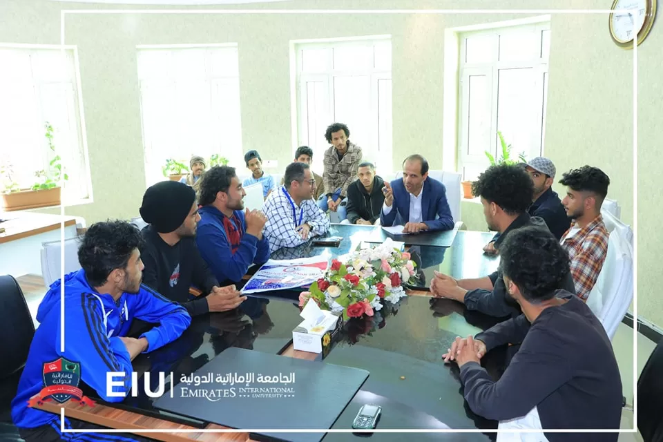 The university president meets the university's first football team and congratulates the university's leadership